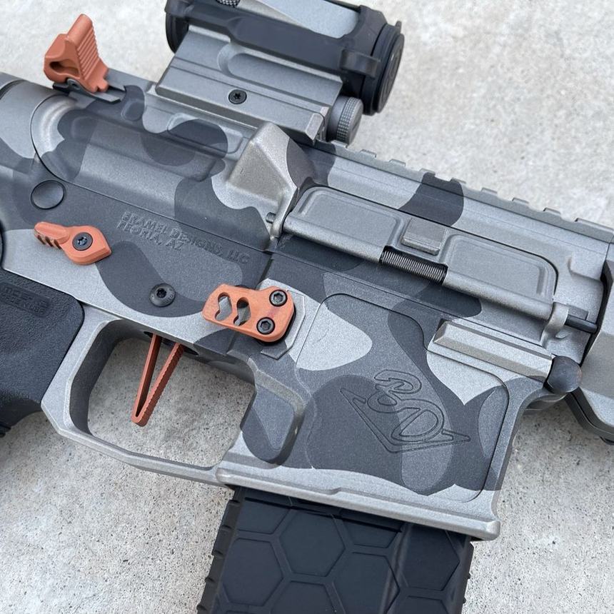 Freehand grey camo Cerakote detail on a stripped lower receiver