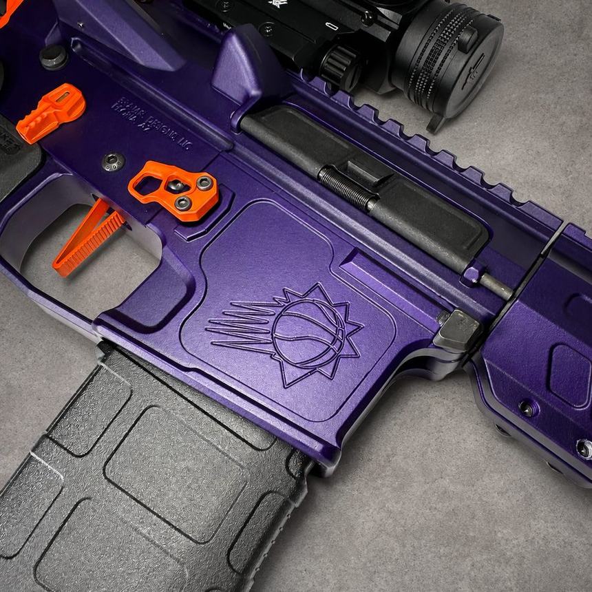 Bright Purple and Hunter Orange Cerakote detail with an engraved mark